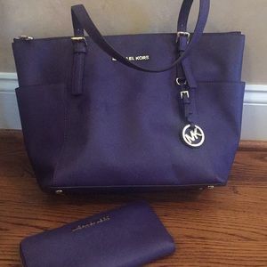 Michael Kors purple handbag with matching wallet